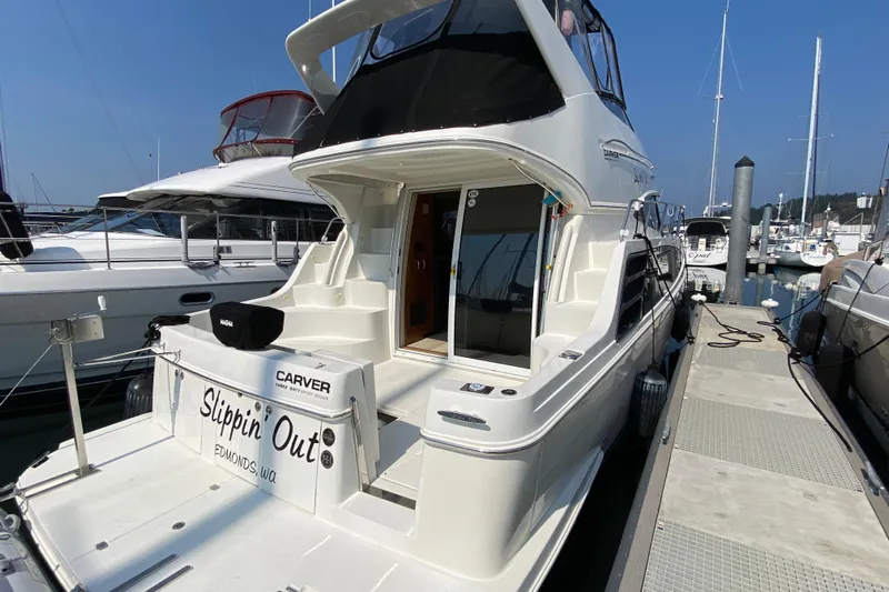 Slippin Out Yacht Photos Pics 2004 Carver 36 Super Sport yacht docked at marina, rear view.