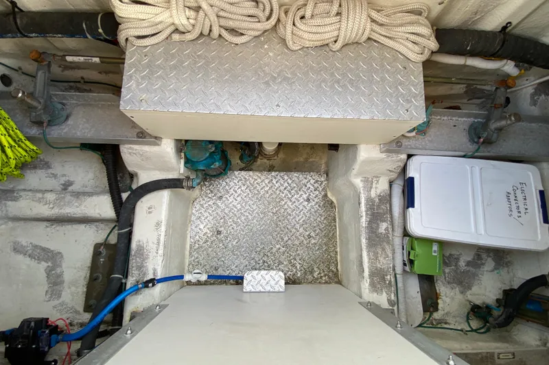 Slippin Out Yacht Photos Pics Engine room of 2004 Carver 36 Super Sport with storage and equipment.