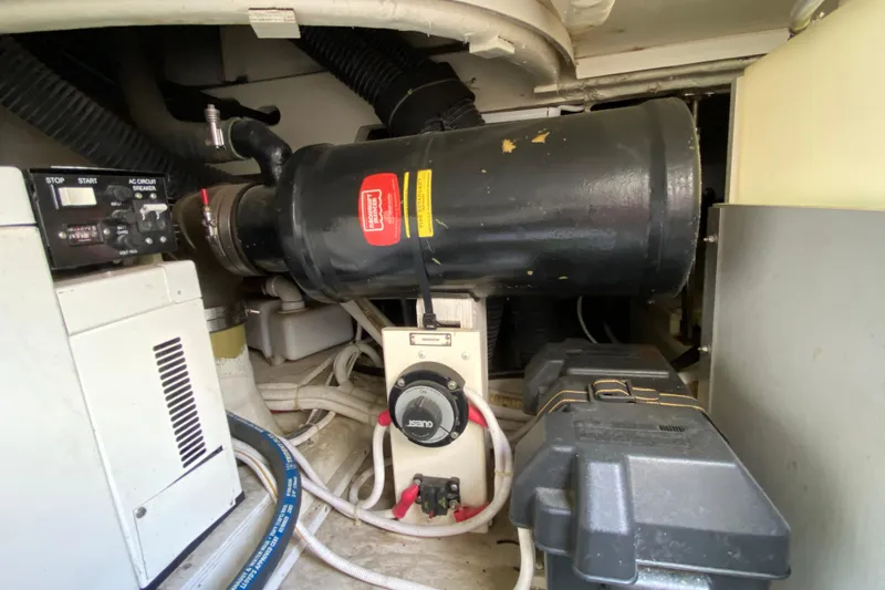 Slippin Out Yacht Photos Pics Engine room of 2004 Carver 36 Super Sport boat, featuring mechanical components and wiring.