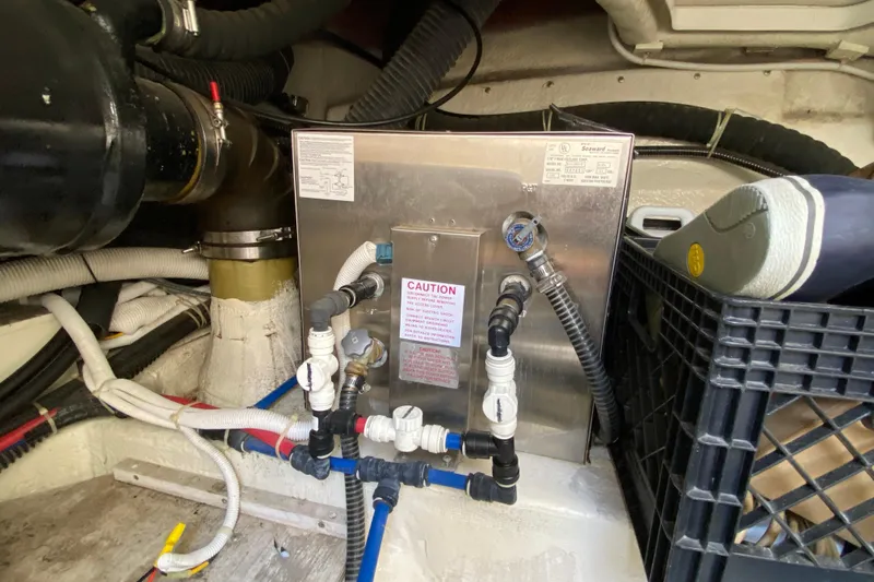 Slippin Out Yacht Photos Pics Engine room of 2004 Carver 36 Super Sport with plumbing and equipment.