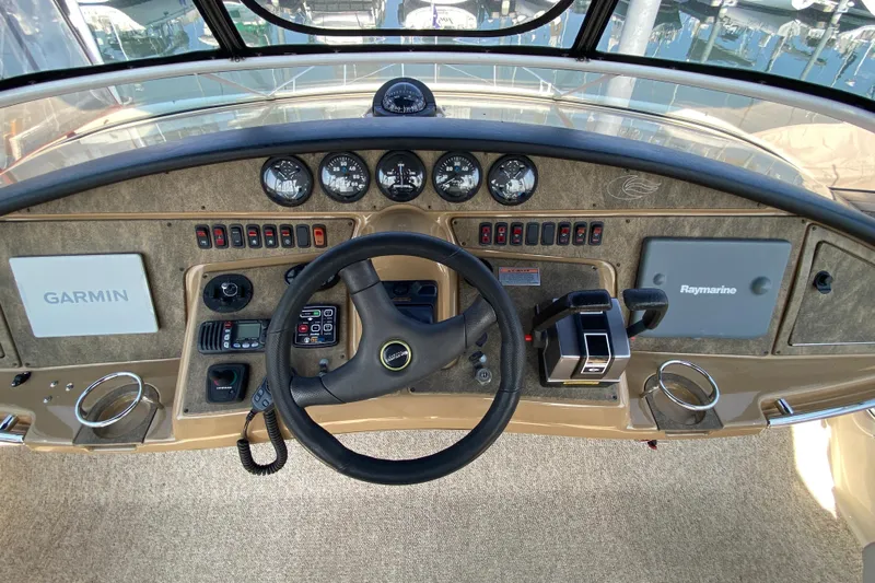 Slippin Out Yacht Photos Pics 2004 Carver 36 Super Sport helm with Garmin and Raymarine navigation systems.