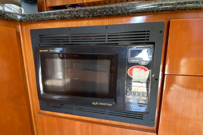 Slippin Out Yacht Photos Pics Built-in Sharp Carousel microwave in 2004 Carver 36 Super Sport yacht kitchen.