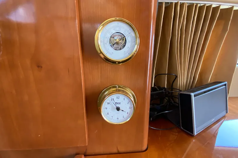 Slippin Out Yacht Photos Pics Wooden panel with clock and barometer on a 2004 Carver 36 Super Sport yacht.
