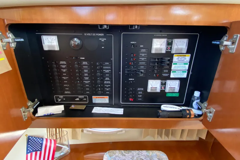 Slippin Out Yacht Photos Pics Control panel inside a 2004 Carver 36 Super Sport yacht, featuring electrical switches and gauges.