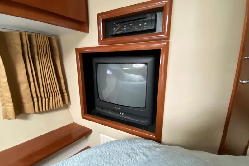 Slippin Out Yacht Photos Pics 2004 Carver 36 Super Sport interior with built-in Panasonic TV and DVD player.