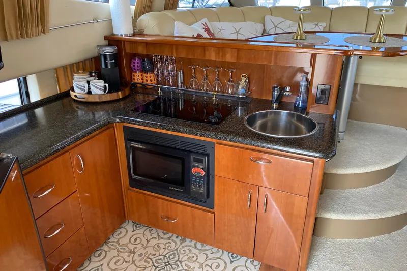 Slippin Out Yacht Photos Pics Luxurious 2004 Carver 36 Super Sport yacht kitchen with modern amenities and elegant design.