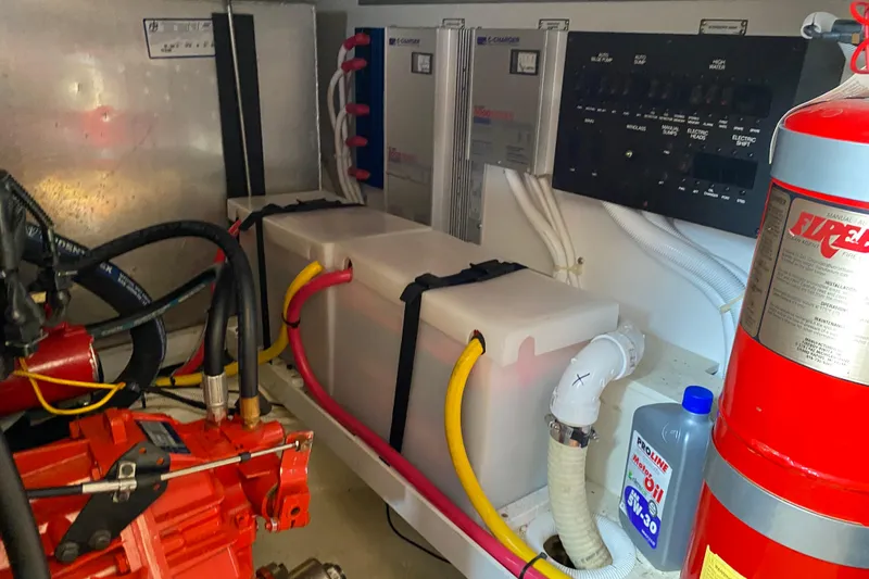 Slippin Out Yacht Photos Pics Engine room of a 2004 Carver 36 Super Sport with fire extinguisher and oil container.