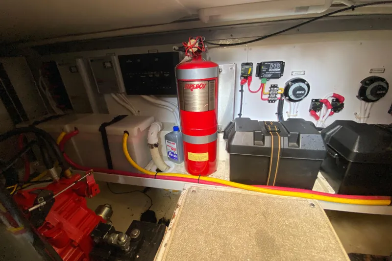 Slippin Out Yacht Photos Pics Engine room of 2004 Carver 36 Super Sport with fire extinguisher and equipment.