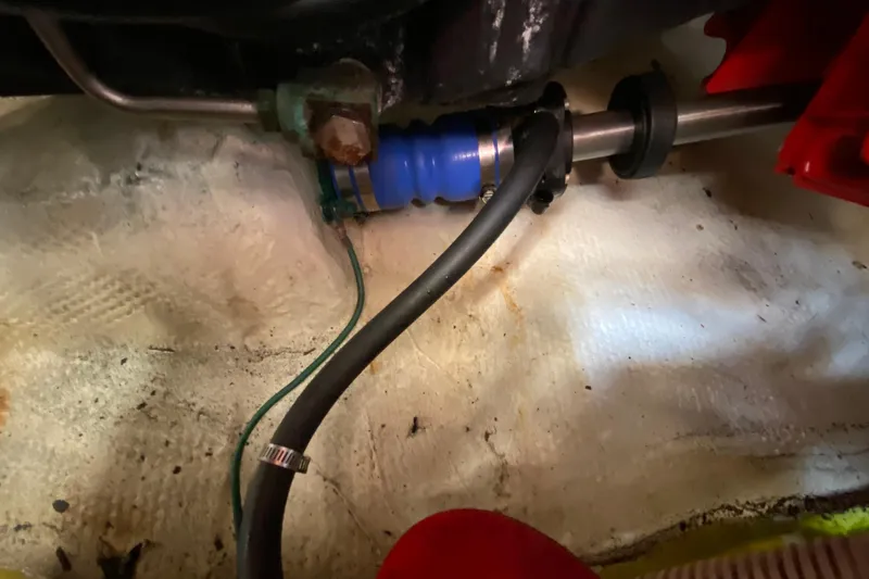 Slippin Out Yacht Photos Pics Close-up of 2004 Carver 36 Super Sport engine compartment with hoses and fittings.