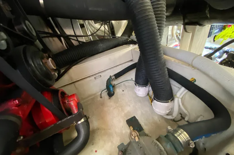 Slippin Out Yacht Photos Pics Engine compartment of a 2004 Carver 36 Super Sport with hoses and mechanical components.