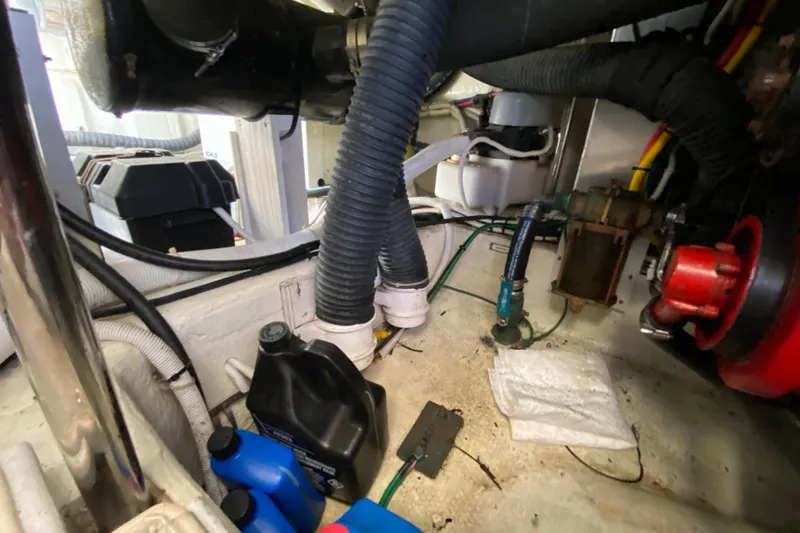Slippin Out Yacht Photos Pics Engine room of 2004 Carver 36 Super Sport with hoses and maintenance supplies.