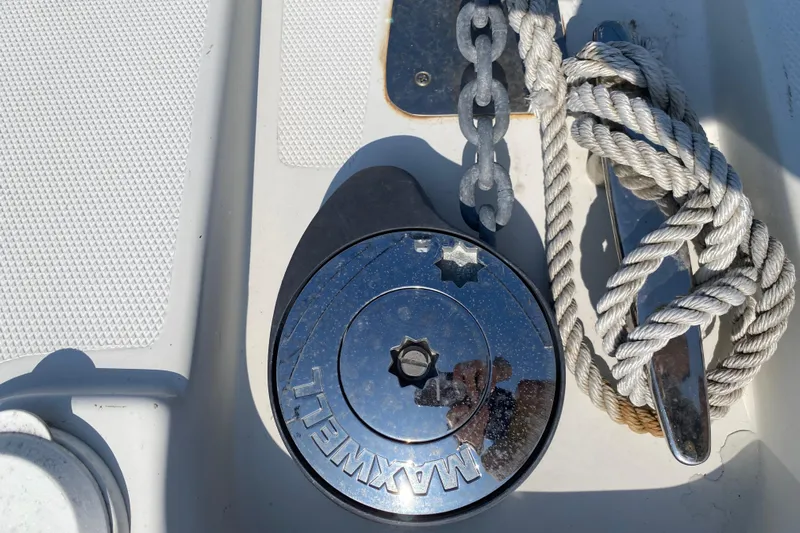 Slippin Out Yacht Photos Pics Anchor windlass and rope on 2004 Carver 36 Super Sport boat deck.