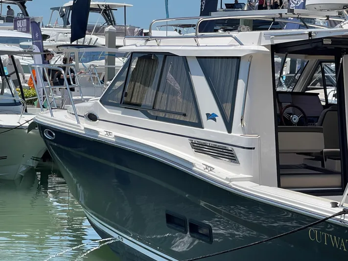  Yacht Photos Pics 2023 Cutwater C-288 boat docked at marina, side view.