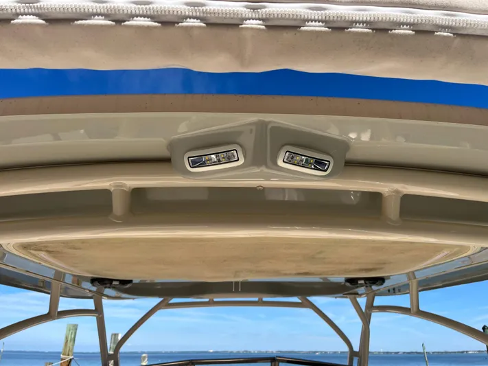  Yacht Photos Pics 2023 Grady-White Freedom 275 boat roof with integrated LED lights, clear sky background.