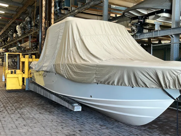  Yacht Photos Pics 2023 Grady-White Freedom 275 boat covered in storage facility.