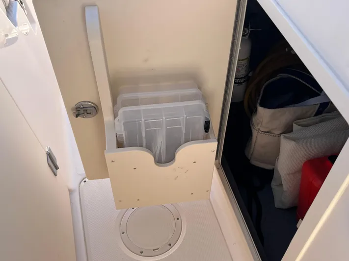  Yacht Photos Pics Storage compartment on a 2023 Grady-White Freedom 275 boat, featuring organized gear and equipment.