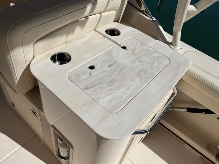  Yacht Photos Pics 2023 Grady-White Freedom 275 boat interior with a sleek countertop and cup holders.