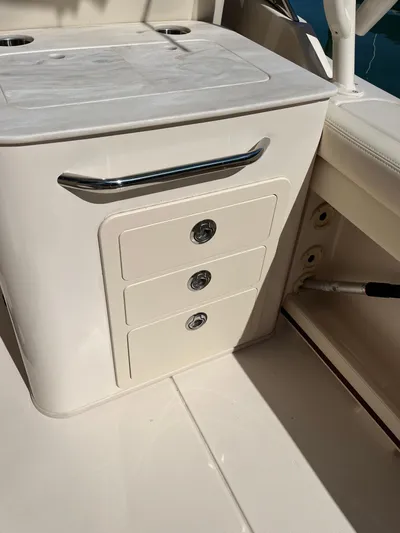  Yacht Photos Pics 2023 Grady-White Freedom 275 boat interior with storage drawers and countertop.