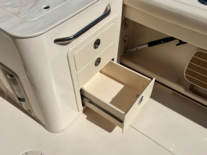  Yacht Photos Pics Open storage drawer on 2023 Grady-White Freedom 275 boat interior.
