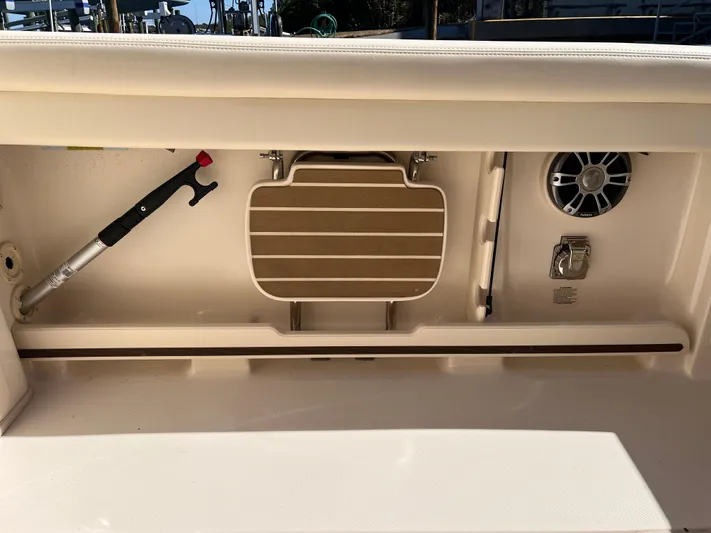  Yacht Photos Pics Storage compartment on 2023 Grady-White Freedom 275 boat with speaker and accessories.