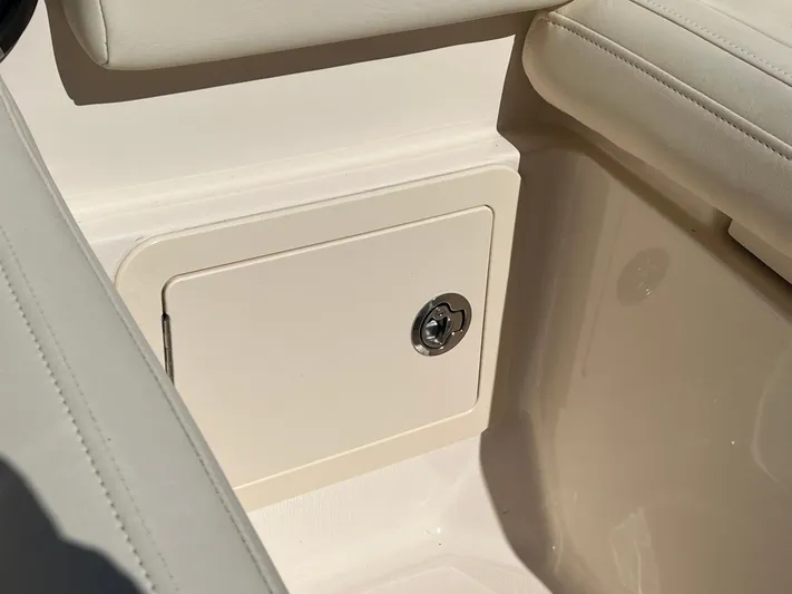  Yacht Photos Pics 2023 Grady-White Freedom 275 boat interior storage compartment with cushioned seating.