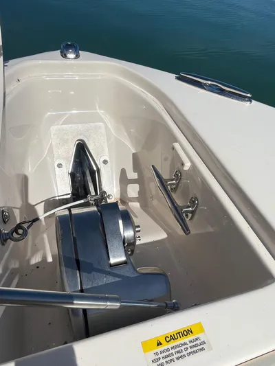  Yacht Photos Pics Anchor compartment of 2023 Grady-White Freedom 275 boat, featuring winch and cleat.