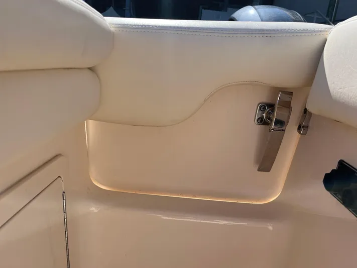  Yacht Photos Pics Interior detail of 2023 Grady-White Freedom 275 boat, featuring a sleek latch and cushioned seating.