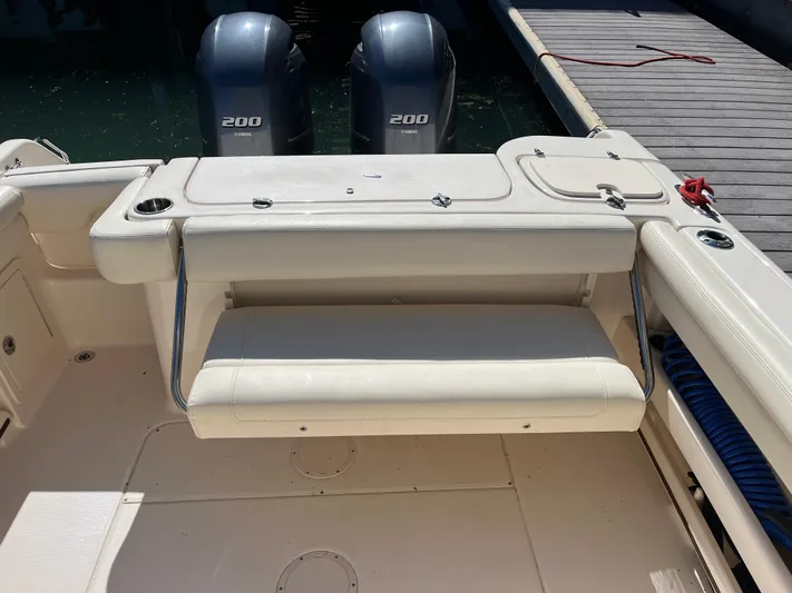  Yacht Photos Pics 2023 Grady-White Freedom 275 boat interior with twin Yamaha 200 engines at dock.