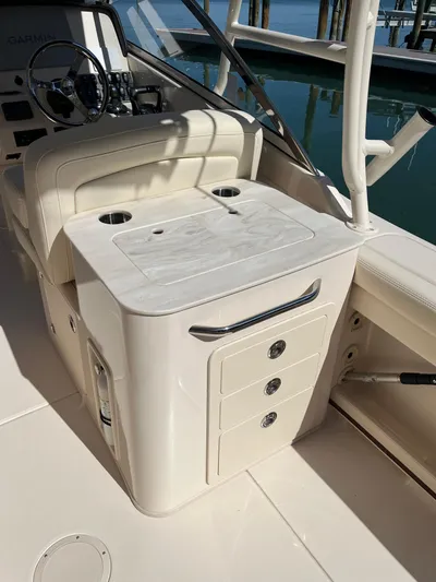  Yacht Photos Pics 2023 Grady-White Freedom 275 boat interior with storage and seating.