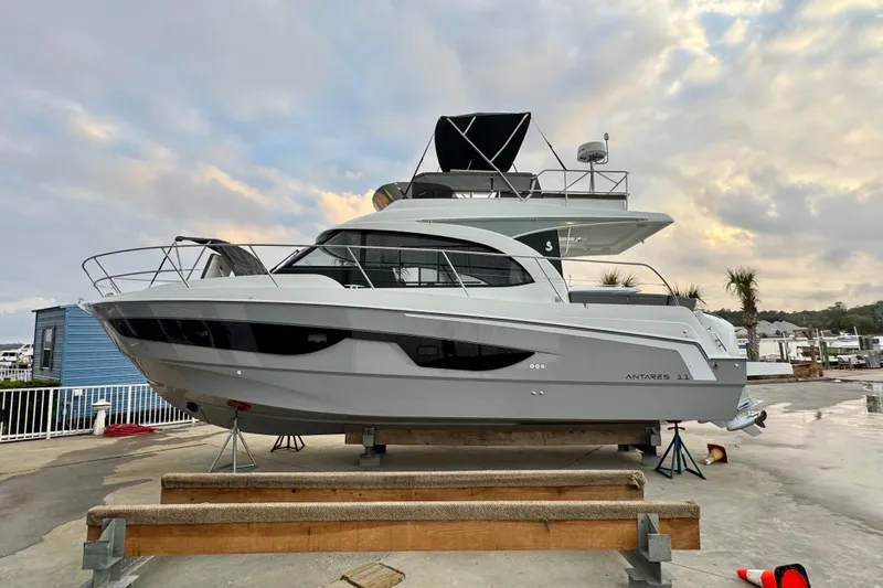 Yacht Photos Pics 2026 Beneteau Antares 11 Fly yacht on display at marina, side view.