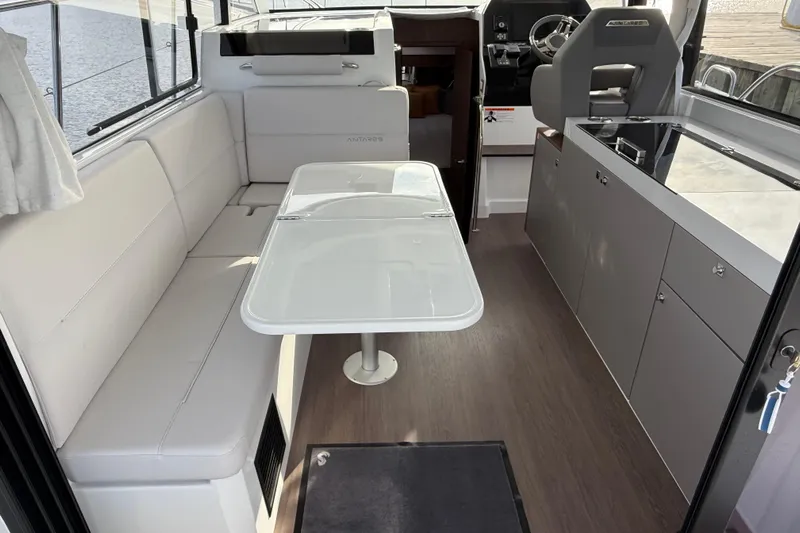  Yacht Photos Pics Interior of 2026 Beneteau Antares 11 Fly, featuring modern seating and dining area.