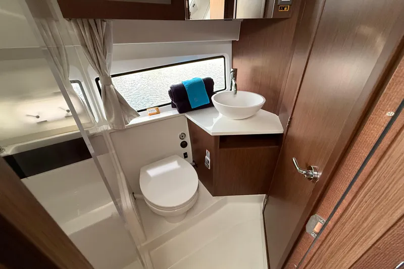  Yacht Photos Pics Modern bathroom interior of 2026 Beneteau Antares 11 Fly yacht, featuring sleek design and amenities.