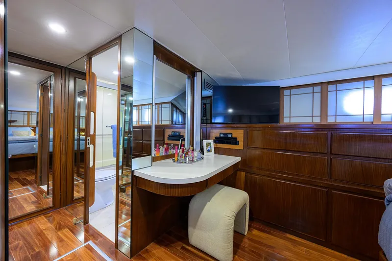 Forever Young Yacht Photos Pics Luxurious interior of 1991 Hatteras 78 CMY yacht with elegant wood finishes and modern amenities.