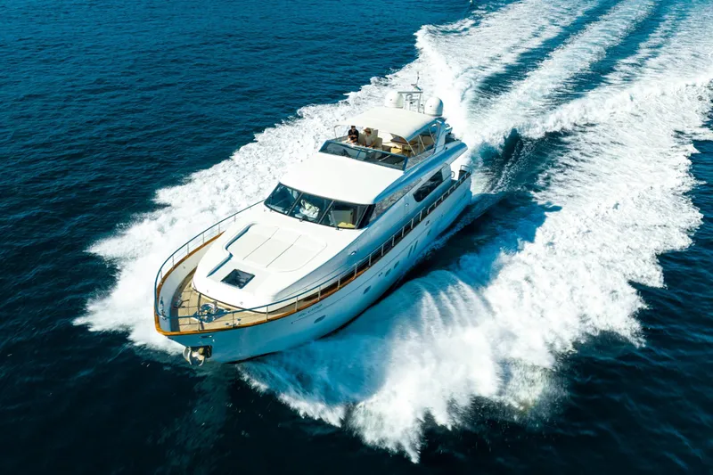 Ilyria Yacht Photos Pics Sanlorenzo SL72 2007 yacht cruising on open sea, creating a dynamic wake.