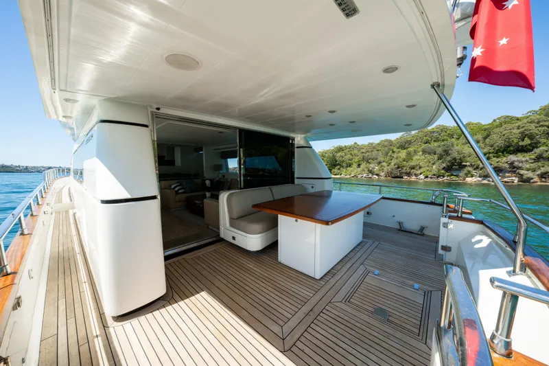 Ilyria Yacht Photos Pics Luxurious 2007 Sanlorenzo SL72 yacht deck with elegant seating and scenic water view.