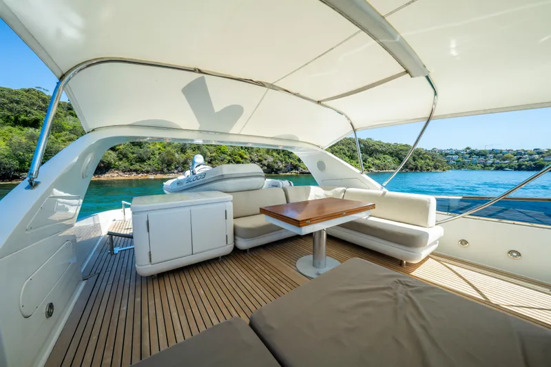 Ilyria Yacht Photos Pics Luxurious 2007 Sanlorenzo SL72 yacht with elegant outdoor seating and scenic ocean view.