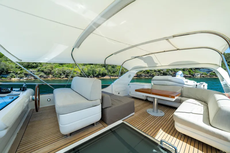 Ilyria Yacht Photos Pics Luxurious 2007 Sanlorenzo SL72 yacht interior with elegant seating and scenic water view.