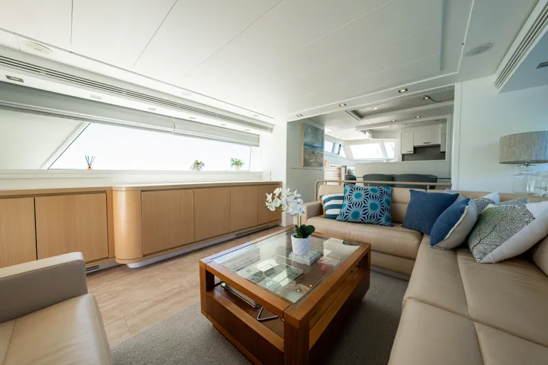 Ilyria Yacht Photos Pics Luxurious interior of 2007 Sanlorenzo SL72 yacht with elegant seating and modern decor.