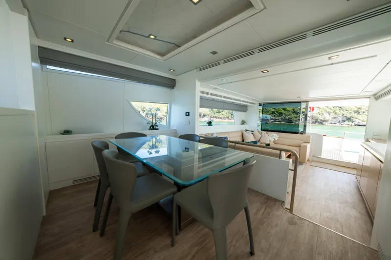 Ilyria Yacht Photos Pics Luxurious interior of 2007 Sanlorenzo SL72 yacht with modern dining area and scenic view.