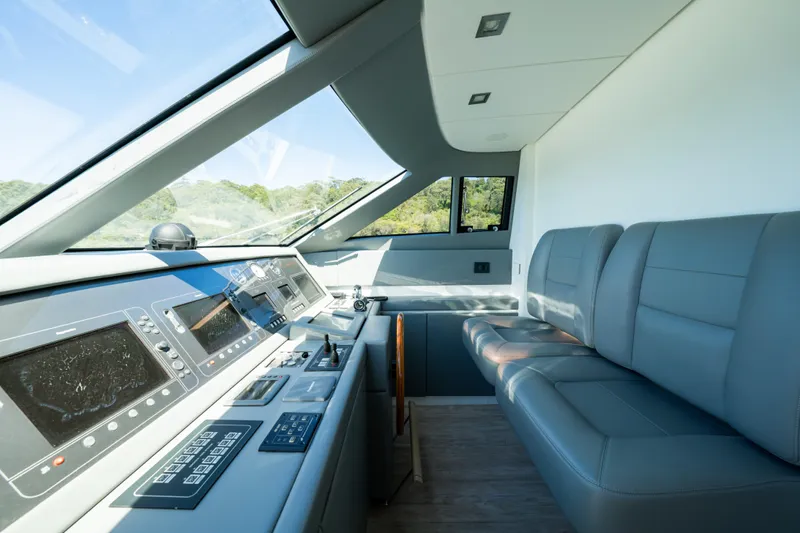 Ilyria Yacht Photos Pics Luxurious 2007 Sanlorenzo SL72 yacht cockpit with modern controls and comfortable seating.