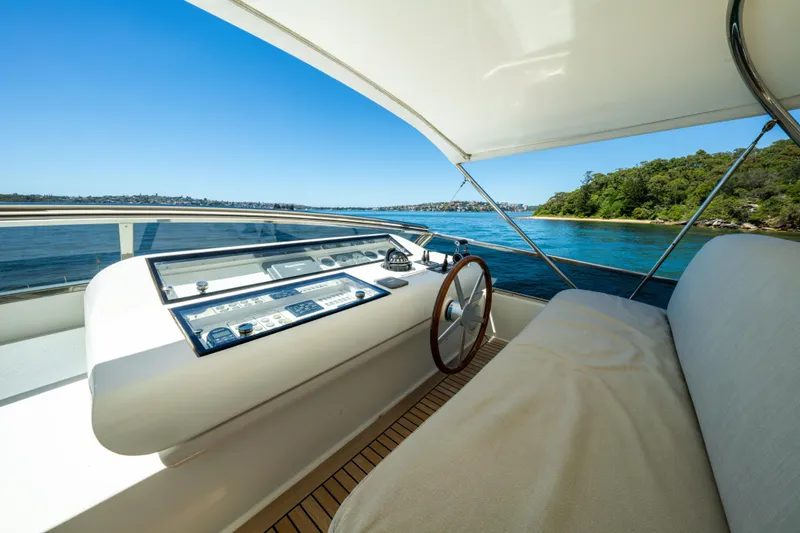 Ilyria Yacht Photos Pics Helm of 2007 Sanlorenzo SL72 yacht with scenic ocean view.