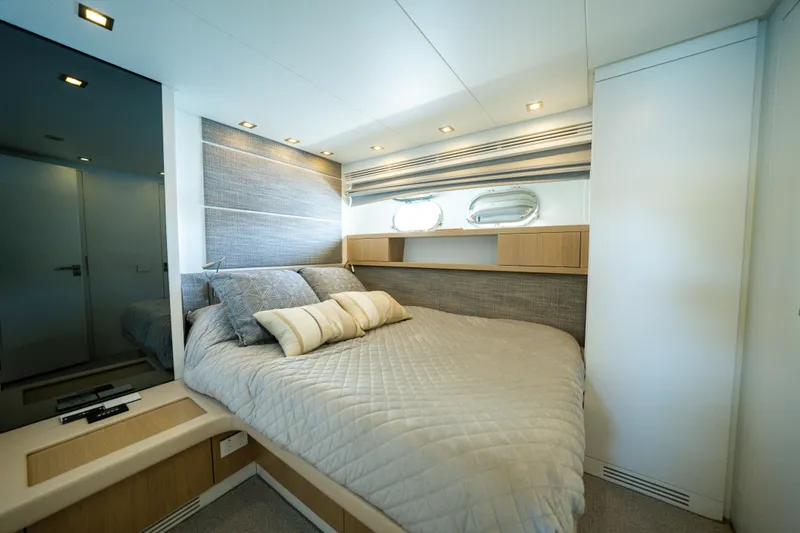 Ilyria Yacht Photos Pics Luxurious bedroom interior of 2007 Sanlorenzo SL72 yacht with modern design and cozy bedding.