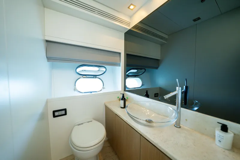Ilyria Yacht Photos Pics Luxurious bathroom on 2007 Sanlorenzo SL72 yacht with modern fixtures and ocean view.