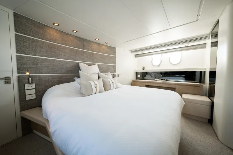 Ilyria Yacht Photos Pics Luxurious bedroom interior of 2007 Sanlorenzo SL72 yacht with modern design and elegant decor.