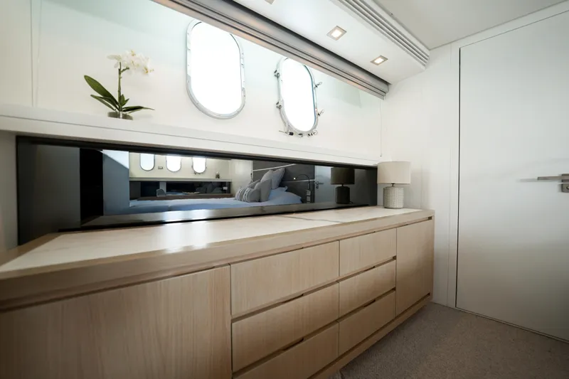 Ilyria Yacht Photos Pics Luxurious interior of 2007 Sanlorenzo SL72 yacht with elegant cabinetry and modern decor.