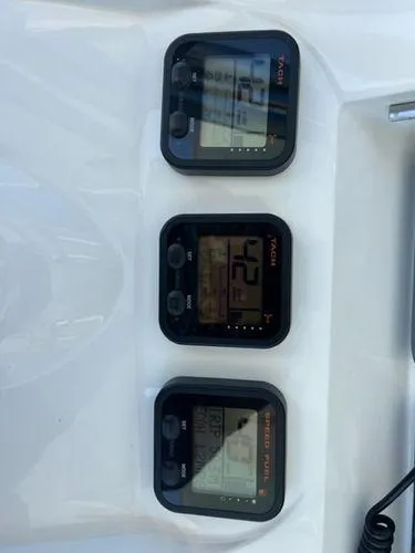  Yacht Photos Pics Boat instrument panel with three digital displays, Spectre 34, 2008 model.