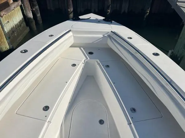  Yacht Photos Pics Bow of a 2008 Spectre 34 boat with sleek seating and storage compartments.