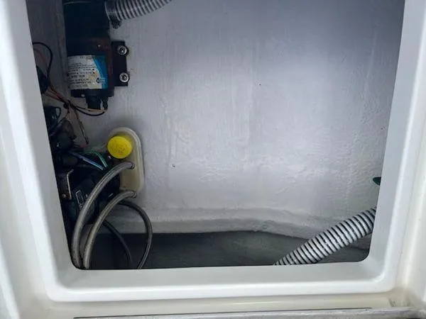  Yacht Photos Pics Interior view of a 2008 Spectre 34 compartment with wiring and hoses.