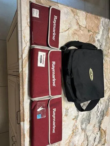  Yacht Photos Pics Raymarine equipment bags and Spectre 34 carrying case on marble surface, 2008 model.