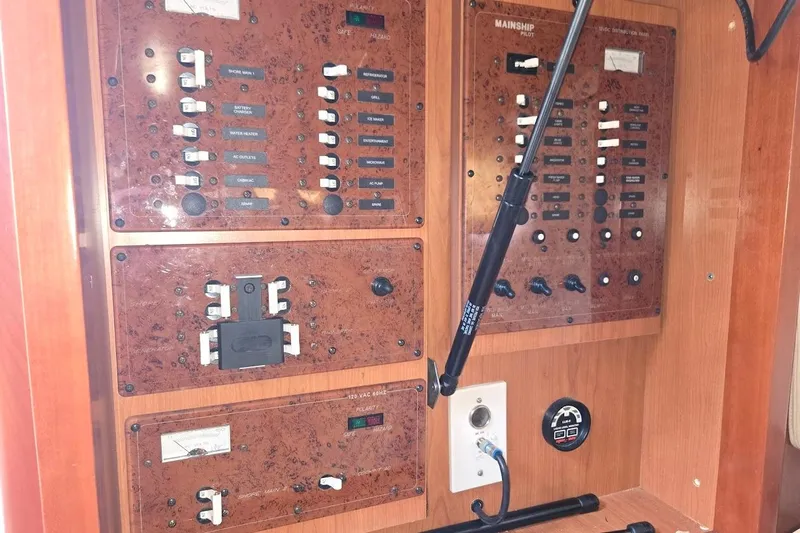 Bay'be Yacht Photos Pics Electrical control panel of 2009 Mainship Pilot 31 boat, featuring switches and gauges.